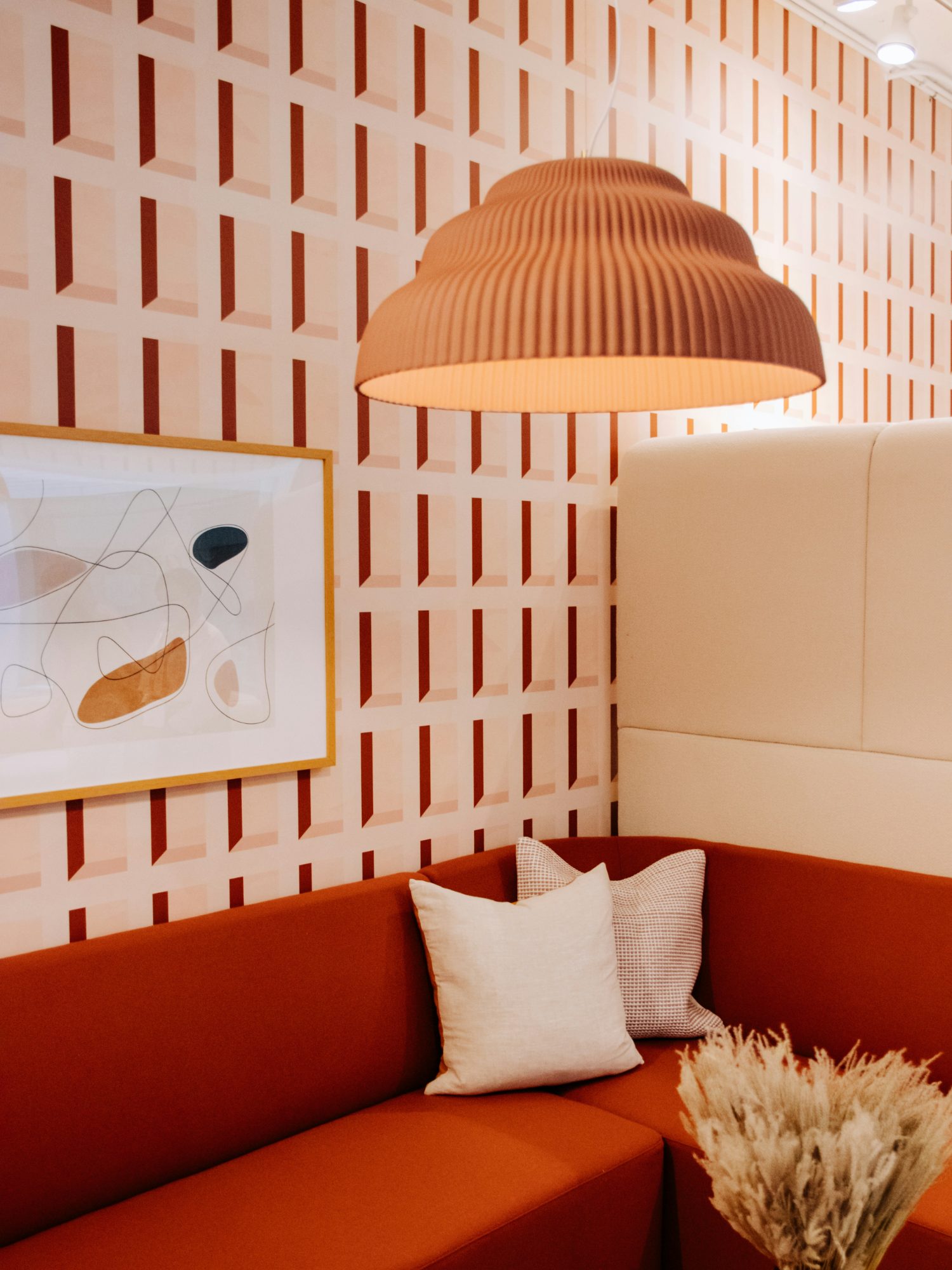 A curated artwork in a warm, design-led interior